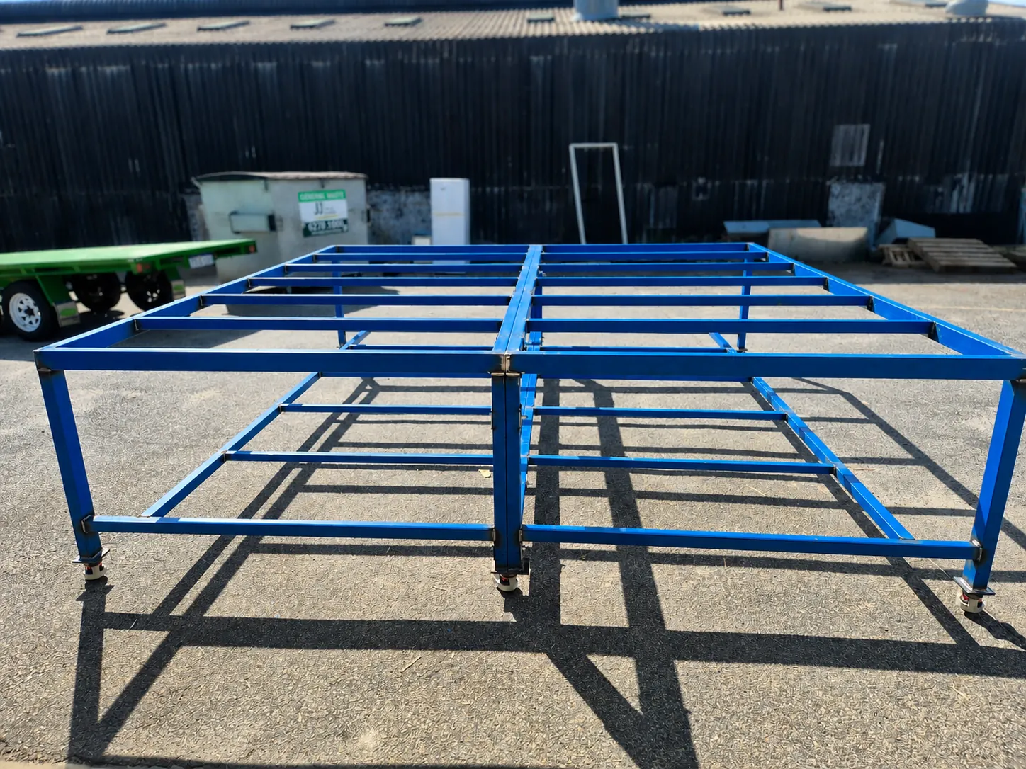 Blue steel workbench with metal top in workshop
