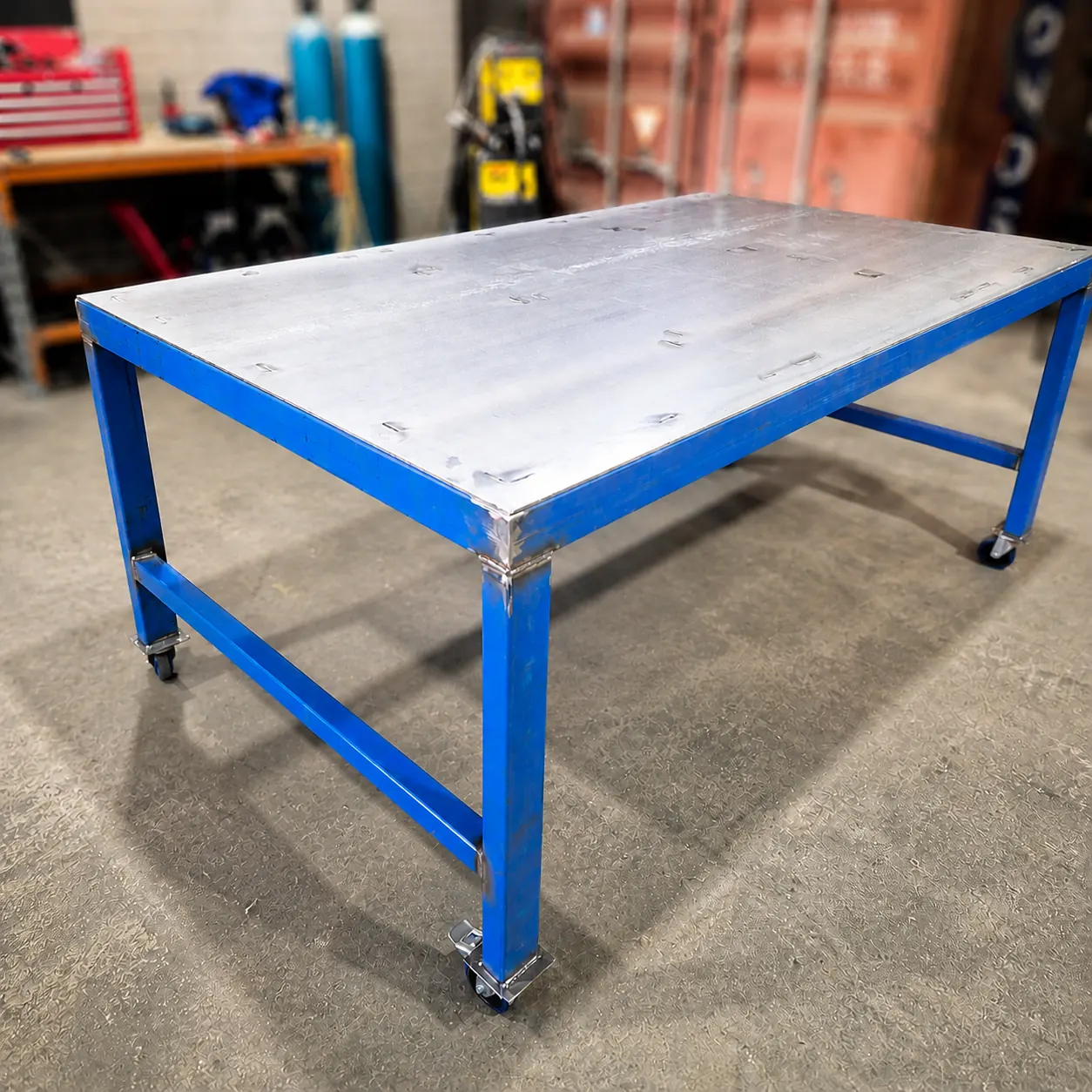 Blue mobile steel workbench with castor wheels
