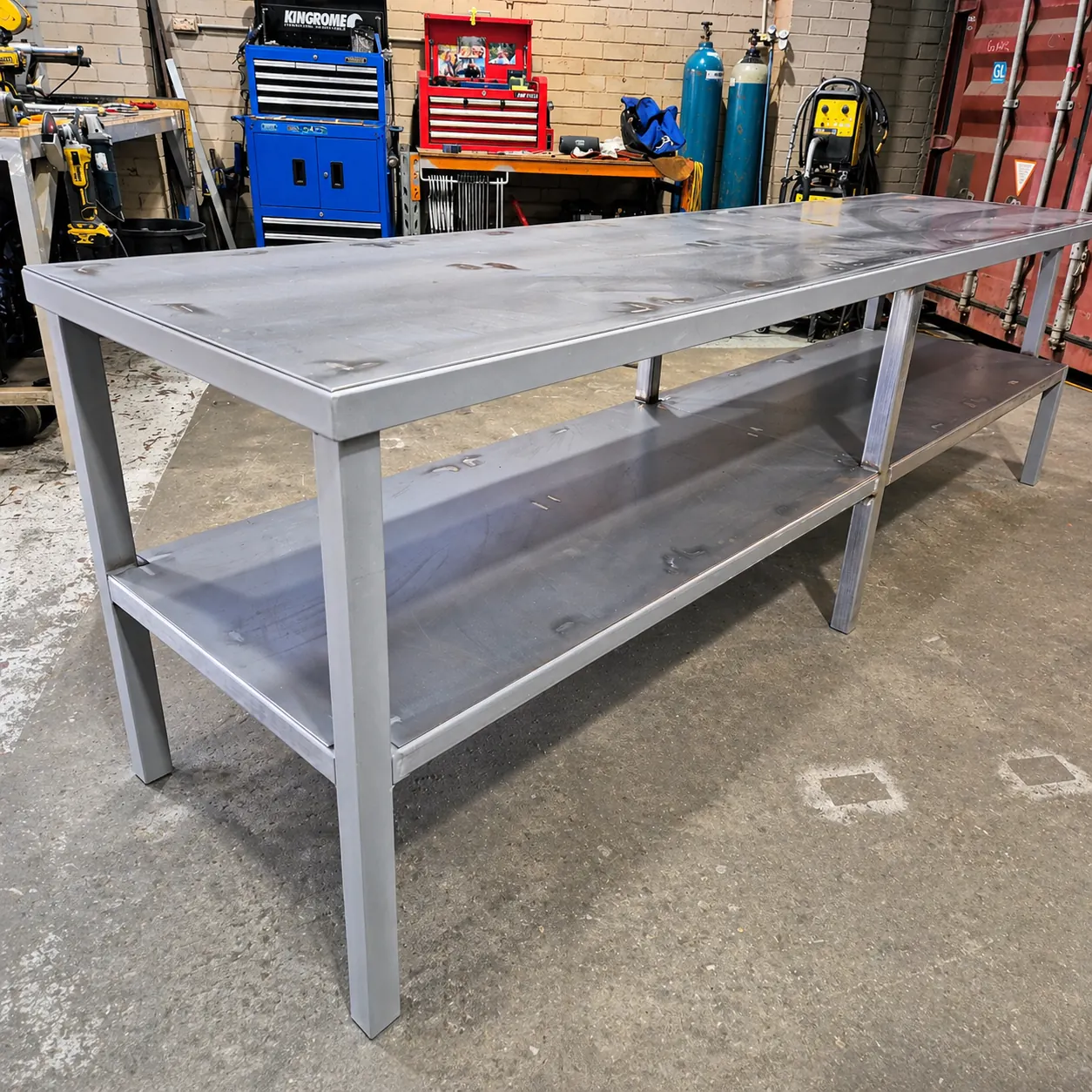 Large blue steel workbench frame on castor wheels